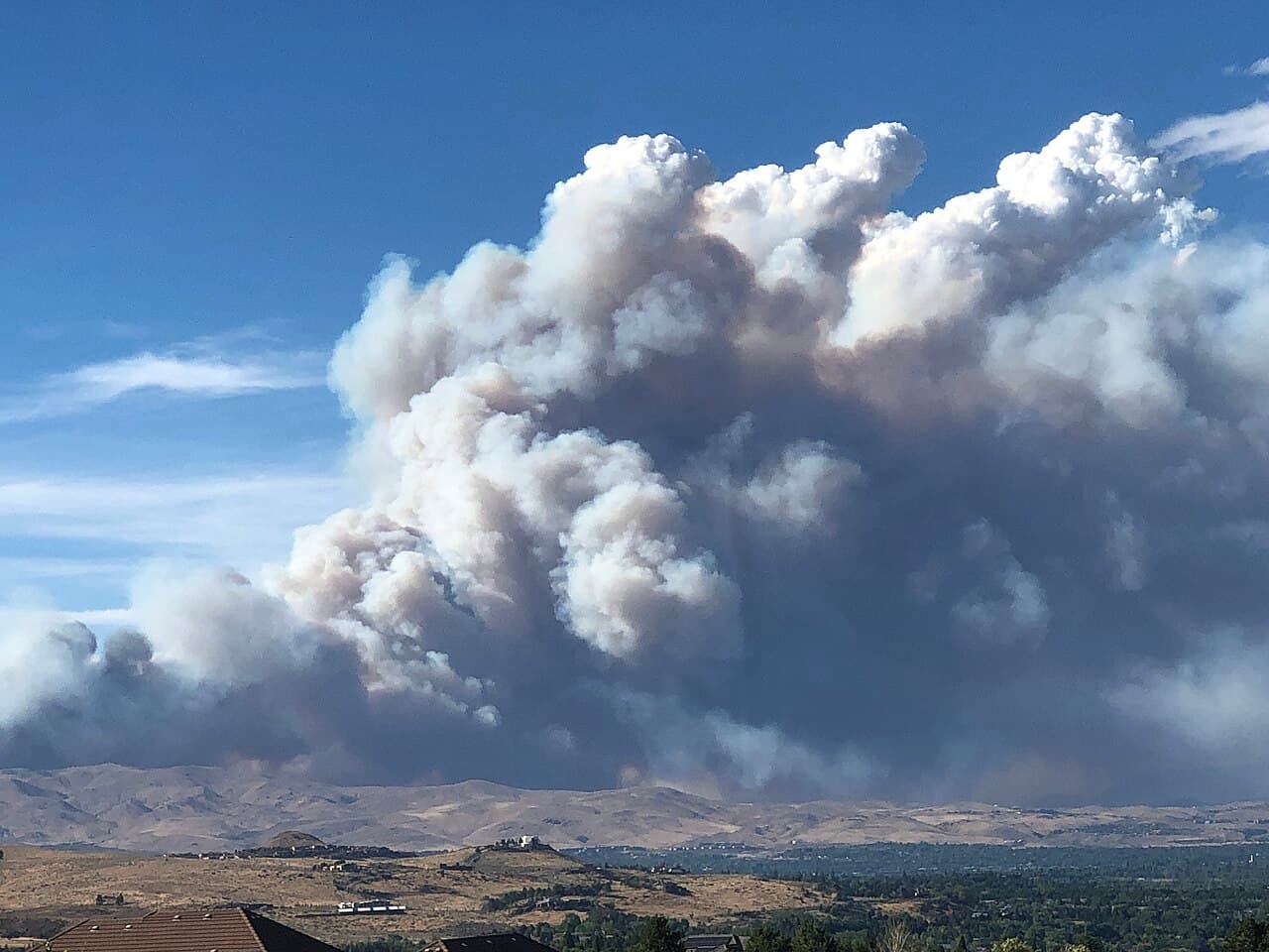 Smoke from the Hawk Fire rising over Peavine Peak near Reno on August 22, 2026