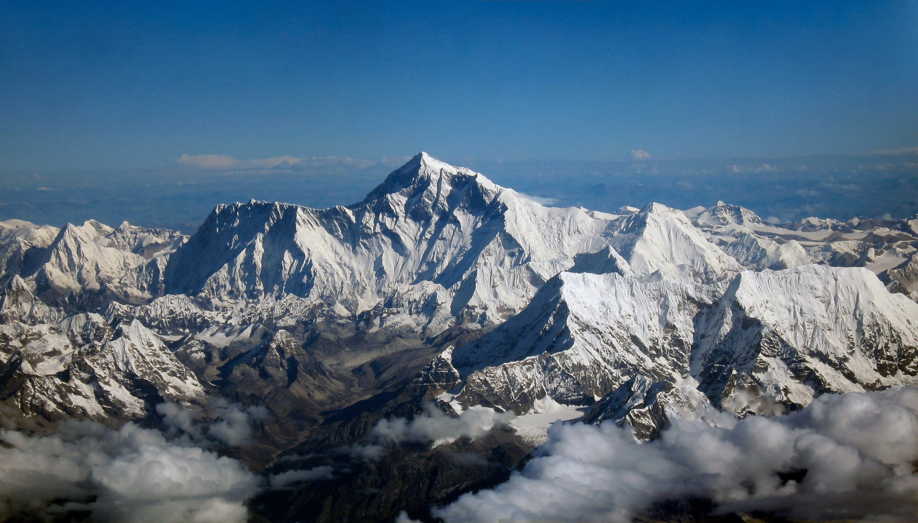 Snow-covered Himalayan peaks seen from the air, the mountain chain where the glacial collapse began
