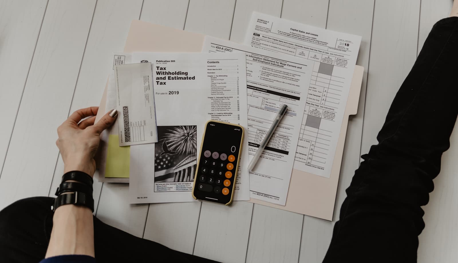 Financial documents and a calculator on a desk, standing in for the grant and fund-of-funds machinery in Uttar Pradesh’s new startup policy